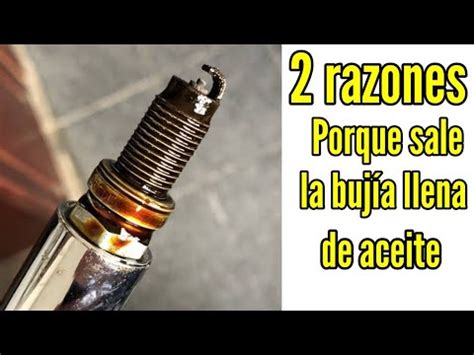 Bujía de encendido manchada de aceite