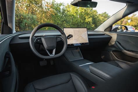 Tesla Model 3 interior con alfombrillas
