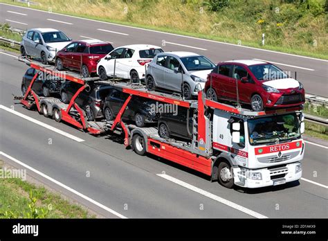 Renault truck carrying a car