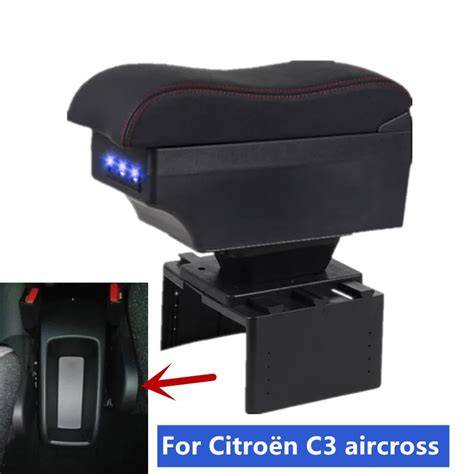 Interior de Citroën C3 con compartimento de almacenamiento del reposabrazos abierto