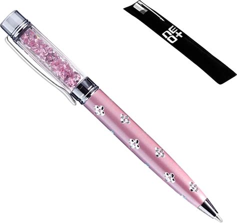 Mano sosteniendo un bolígrafo Swarovski con cristales brillantes