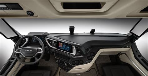 Interior of an IVECO truck cabin with comfortable seating and advanced dashboard