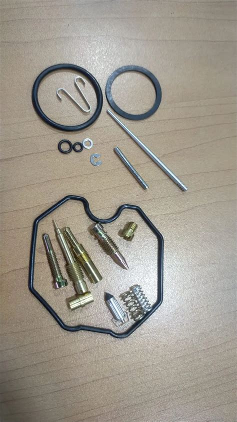 Ilustración de un carburador con el conjunto del flotador y la aguja